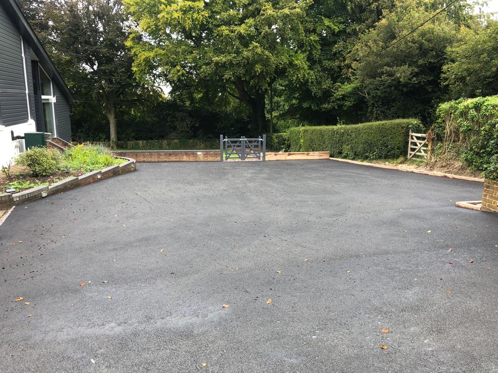 This is a photo of a bitumen driveway which is in the process of being installed by Stirling Road Tech SA